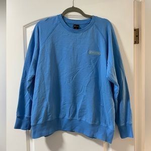 Blue Peloton crew neck, women’s size XL
